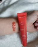 esw beauty cherry tart smoothie advacned smoothing lip treatment featuring shea butter and peptides with example of colour on model's arm